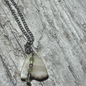 Sheep Horn Pendant with Peridot and glass beads.
